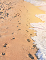 Footprints of a couple on a beach reflecting a journey of married life