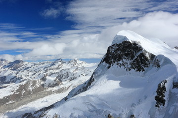 Fototapeta na wymiar The view from the Klein Matterhorn (3,883 m) showcases the highest peaks of the Swiss Alps. Valais, Switzerland.