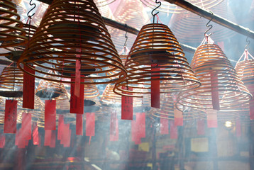 Jesus Light and the hanging incenses inside the Man Mo Temple in Hong Kong