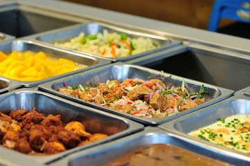 Steel tray filled with food inside the self service Chinese restaurant