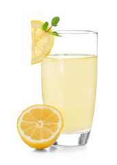 Delicious lemon juice in glass on white background
