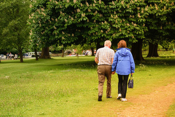 Aged people walking in park