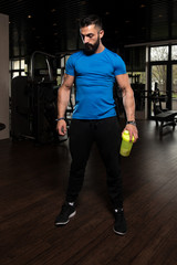 Bodybuilder Drinking Water From Shaker