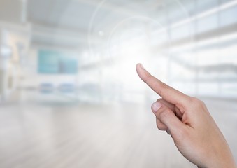 Hand touching air in bright gym sports hall