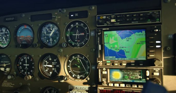POV cockpit view of small plane instruments and flight controls