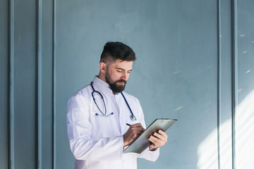 Doctor working near window in a hospital. 