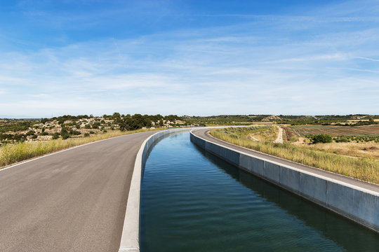 Curved Irrigation Canal in Farmland Landscape