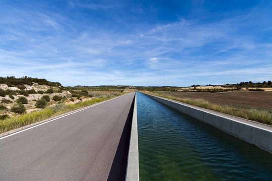 Straight Irrigation Canal in Farmland Landscape