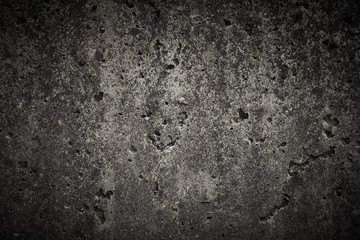 dunkle poröse betonwand vignettiert hintergrund textur