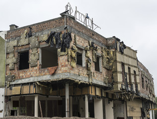 Old abandoned building with some isolation hanging from walls