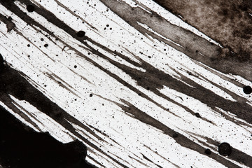 diagonal strokes of black ink on paper, abstract background