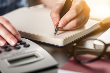 Woman with calculator.