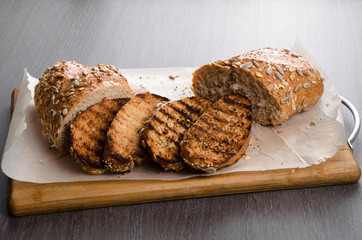 toasted bread, on wooden background