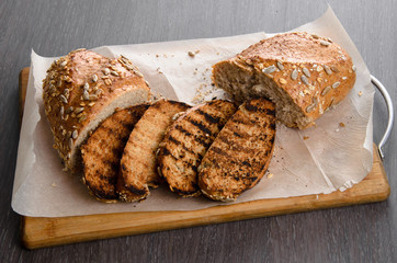toasted bread, on wooden background