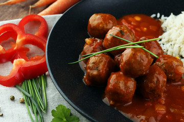 Delicious meatballs made from ground beef in a spicy tomato sauce