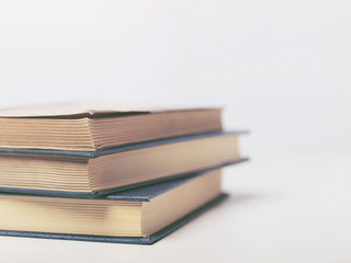 Pile of old books on white background