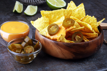 A plate of delicious tortilla nachos with melted cheese sauce