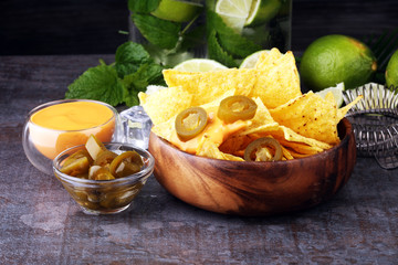 A plate of delicious tortilla nachos with melted cheese sauce