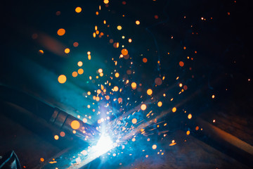 artistic welding sparks light, industrial background