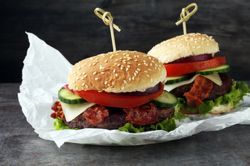 fresh tasty burger on grey background