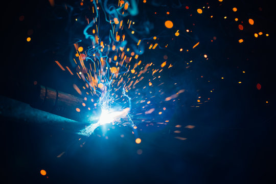 artistic welding sparks light, industrial background