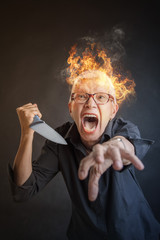 infuriated angry senior woman slaying, holding a kitchen knife, about to kill someone