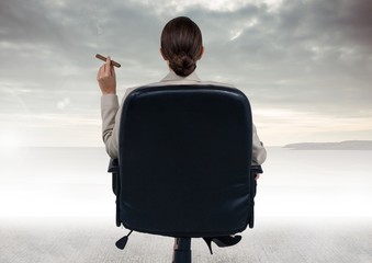 Fototapeta premium Businesswoman Back Sitting in Chair with cigar and ocean view