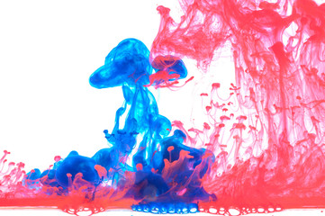 Abstract mixing colored paint in the water