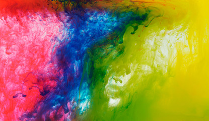 Abstract mixing colored paint in the water