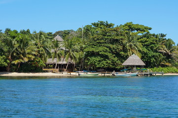 Coastline with an eco resort and lush tropical vegetation, Bocas del Toro, Caribbean sea, Panama, Central America
