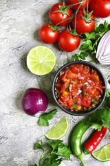 Ingredients for making tomato salsa (salsa roja).Top view with copy space. - obrazy, fototapety, plakaty