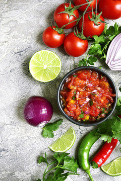 Ingredients for making tomato salsa (salsa roja).Top view with copy space.
