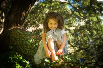 outdoor portrait of young child girl in magic forest, outdoor natural background