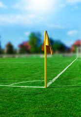 Fototapeta premium Yellow flag in corner of football playground