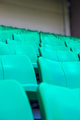 Fototapeta premium Green plastic seats at stadium
