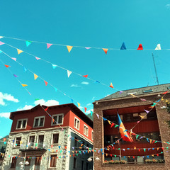 Street of Andorra La Vella decorated with colorful pennants