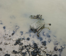 Rubbish on bank of river Medway, Kent