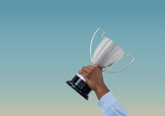 business hand with trophy.blue background