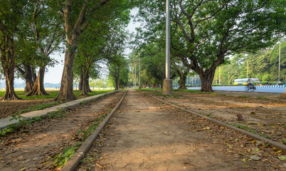 Tram tracks of the city tramway running through the scenic Maidan area of Kolkata India.