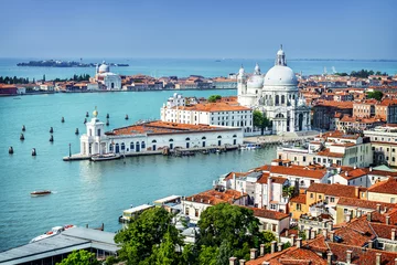 Fototapeten Beautiful view of the Grand Canal and Basilica Santa Maria della Salute in the late evening with very interesting clouds, Venice, Italy © beatrice prève