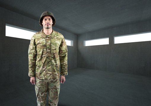 soldier with helmet in dark concrete room