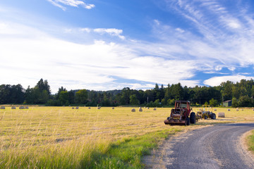 Tractors on the field during the haymaking