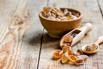 brown sugar cubes for cooking sweets on kitchen wooden table