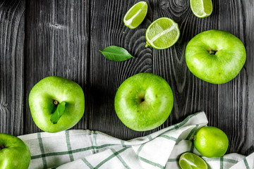 summer food with green apples on dark background top view