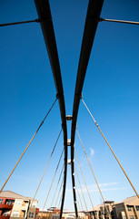 Tubular and rope pedestrian bridge and houses