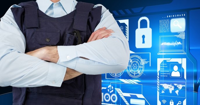 Policeman with his hands crossed standing on