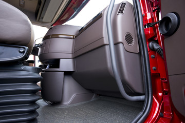 Details of interior red semi truck with open door