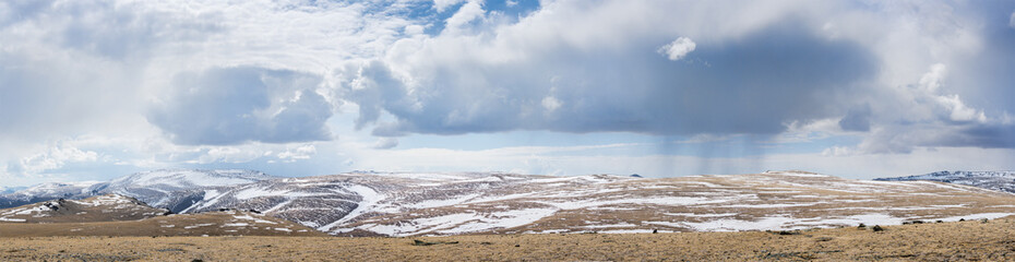 majestic mongolia prairie with mountains on background at cloudy day
