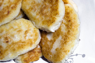 Fried delicious nutritious potato pancakes in-form pastries on plate