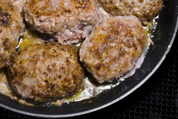 Beef Meat patties fried with oil on frying pan